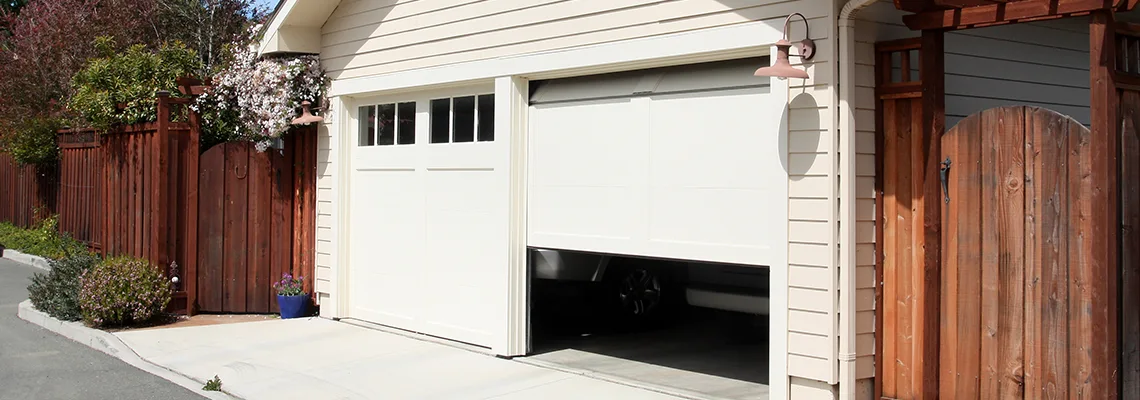 Fix Metal Garage Door Jerking in Milton, Ontario